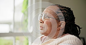 Mature woman, anxiety and thinking on retirement, stress and worry by window for future. Black female person, depression