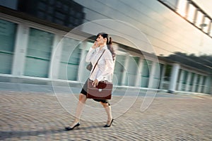 Mature Woman Arriving Late To Office Walking Fast On Street