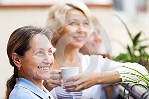 Mature woman on a balcony