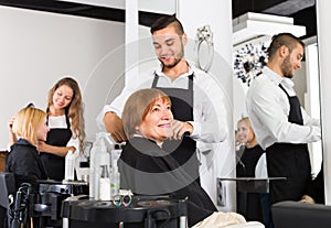 Mature woman in the barbershop.