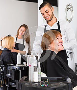 Mature woman in the barbershop