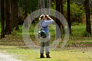 Mature woman birdwatching