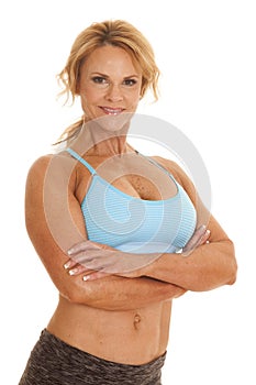 Mature woman blue bra arms folded