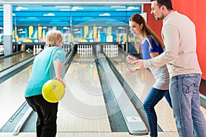 Mature woman bowling