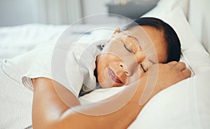 Mature, woman and calm while sleeping in bed with good dream, head on pillow and peace. Asian, elderly person and face