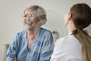 Mature woman clinic patient laughing during her visit in clinic