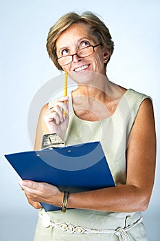 Mature woman with clipboard