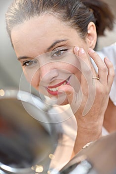 Mature woman and cosmetics