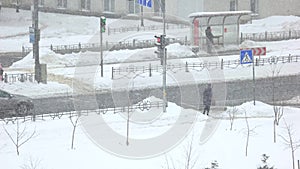 Mature woman crossing the street in a winter.