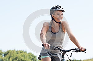 Mature woman cycling