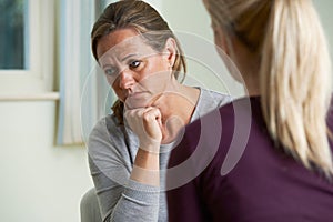 Mature Woman Discussing Problems With Counselor