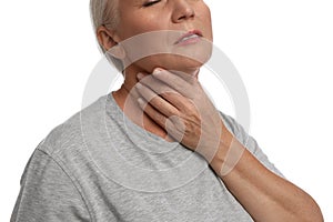 Mature woman doing thyroid self examination on white background, closeup