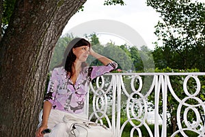 Mature woman dreaming on a bench