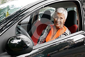 Mature woman driver in her car