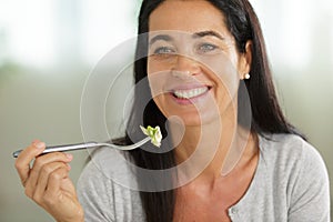 Mature woman eating meal