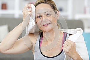 mature woman after exercising with towel