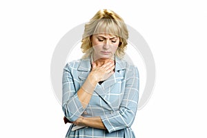 Mature woman feeling sore throat.