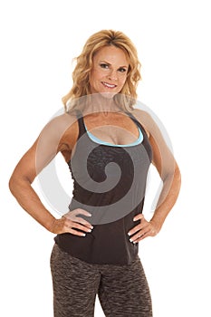 Mature woman fitness hands hips smile