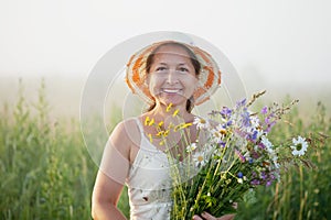 Mature woman with flowers posy