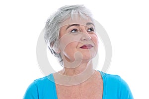 Mature woman gazes serenely into their future - isolated on whit photo