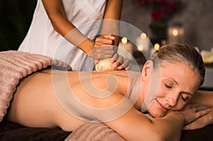 Mature woman having ayurvedic massage