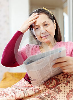 Mature woman having grief after readed news