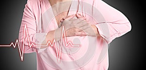 Mature woman having heart attack