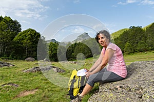 Mature woman hiking in the Pyrenees mountains