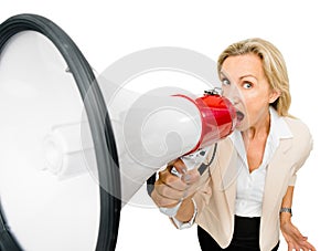 Mature woman holding magaphone shouting isolated on white background