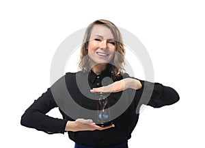 Mature woman with hourglass on white background. Time management concept