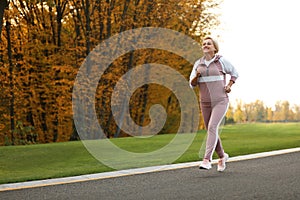 Mature woman jogging in park