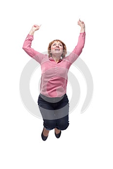 A mature woman jumping into the air with excitement