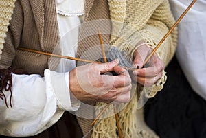 Mature woman knitting wool