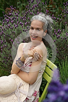 Mature woman laughing Garden Lavender Retro look