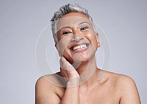 Mature woman, laughing or skincare face glow on grey studio background mock up in wellness, healthcare or dermatology