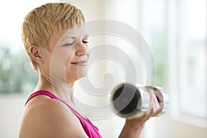 Mature Woman Lifting Weights photo