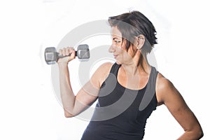 Mature woman lifting weights photo