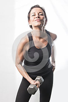 Mature woman lifting weights photo
