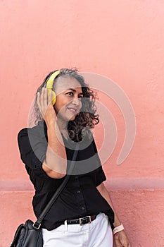 Mature Woman Listening To Music And Dancing