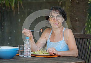 Mature woman lunch in the garden