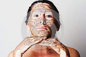 Mature woman making cosmetic mask