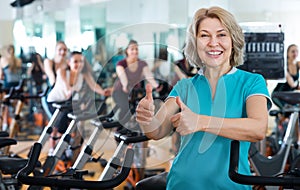 Mature woman in modern gym