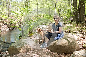 Mature Woman outdoors with dog