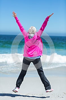 Mature woman outstretching her arms