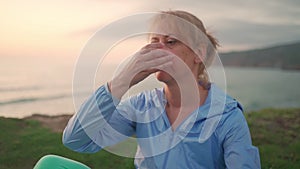 Mature woman performing breathing pranayama