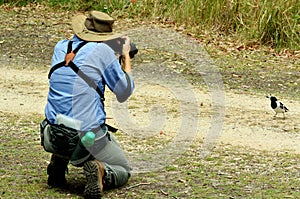 Mature woman photographing wildlife