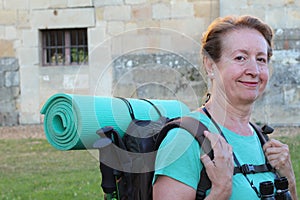 Mature woman pilgrim resting , Way of St James, Camino de Santiago, to Compostela, Galicia, Spain