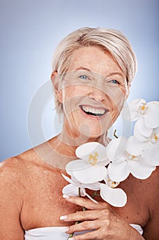 Mature woman, portrait and beauty with a flower for organic or natural skincare and bodycare. Face, senior female and