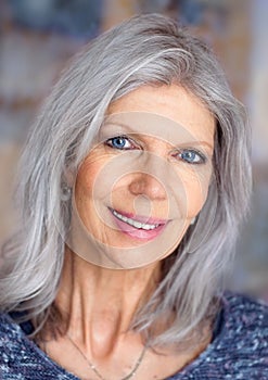 Mature woman portrait smiling relaxed at camera