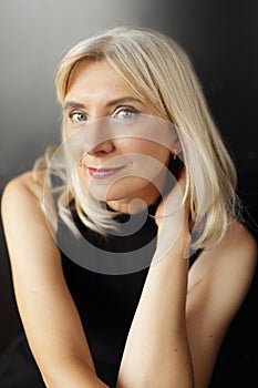 mature woman posing over black background